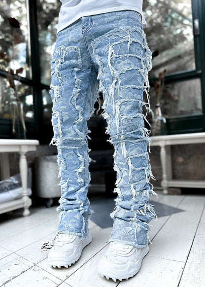 Modische Herren-Jeans mit Fransen und Rissen, individuell gepatcht, schmal geschnittene Stacked Jeans